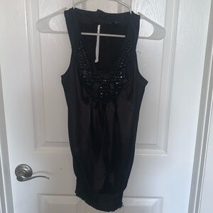 Black blousy top with embellishments